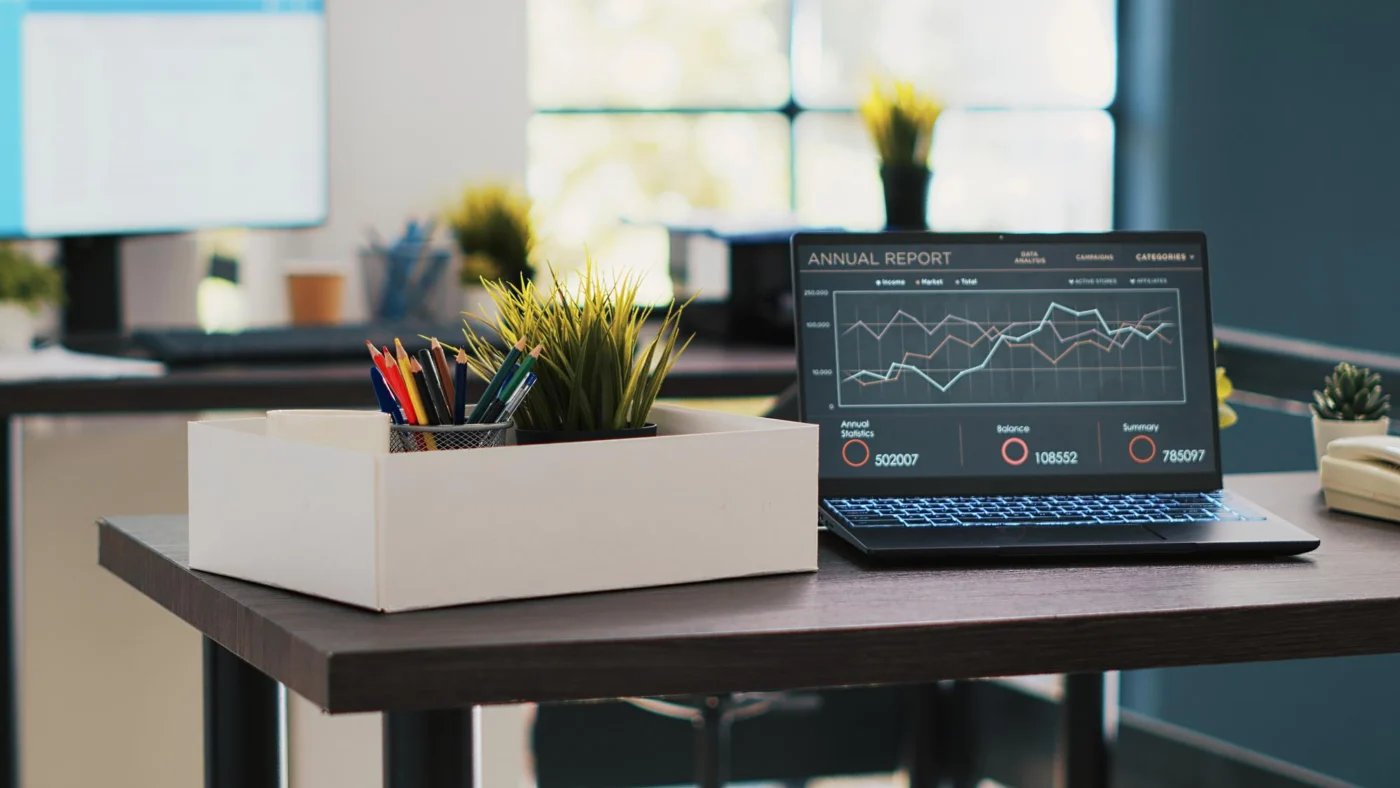 A limited company director reviewing take-home pay figures on a laptop at a home office