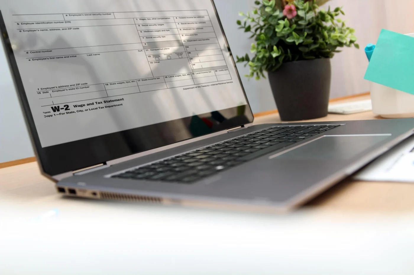 A calendar and a laptop on a desk marking a filing deadline