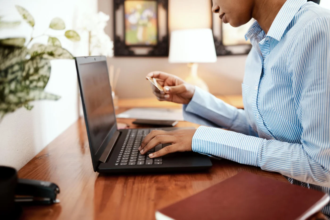 A contractor comparing umbrella and limited company pay on a laptop