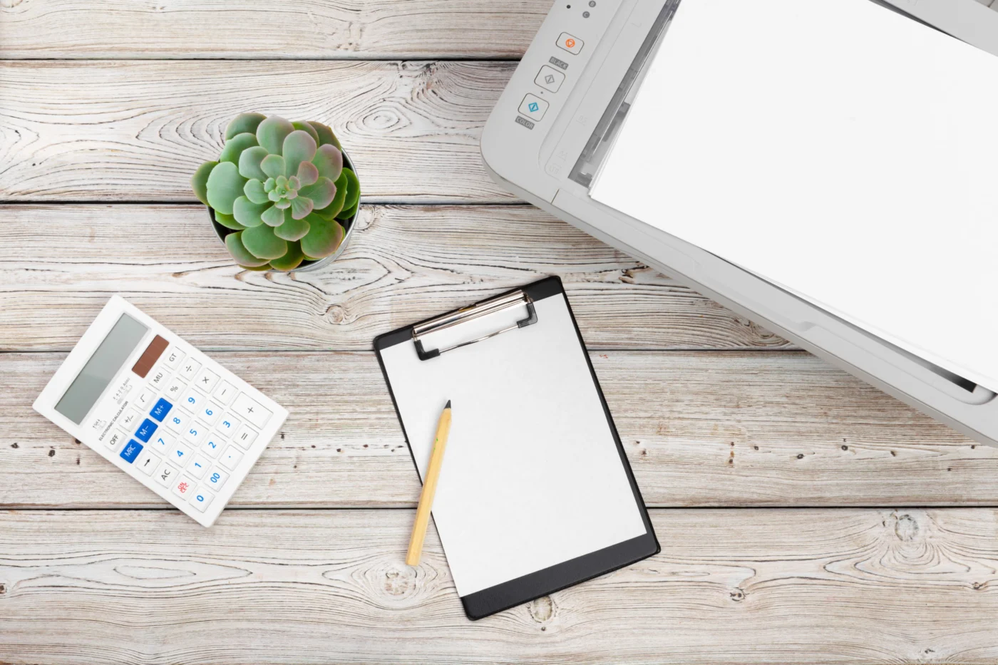 A shop or studio owner checking sales records on a tablet