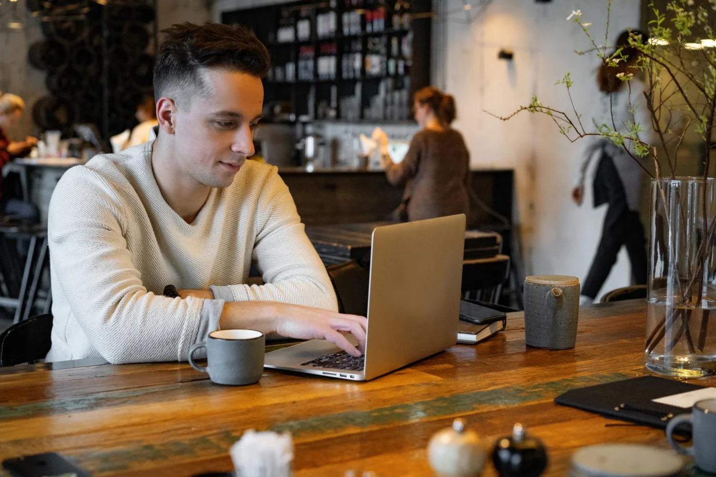 A director and an accountant reviewing salary and dividend figures together at a desk