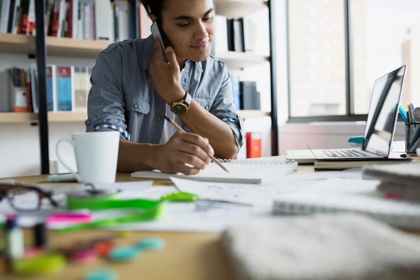 A business owner planning at a home-office desk