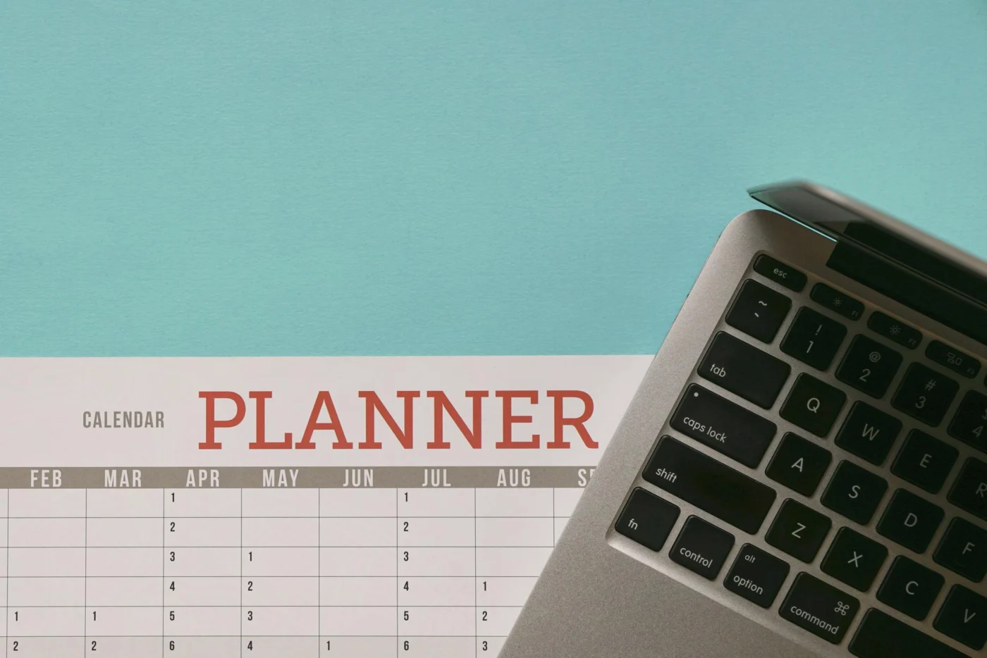 A tidy desk with a wall planner and diary marking company filing deadlines
