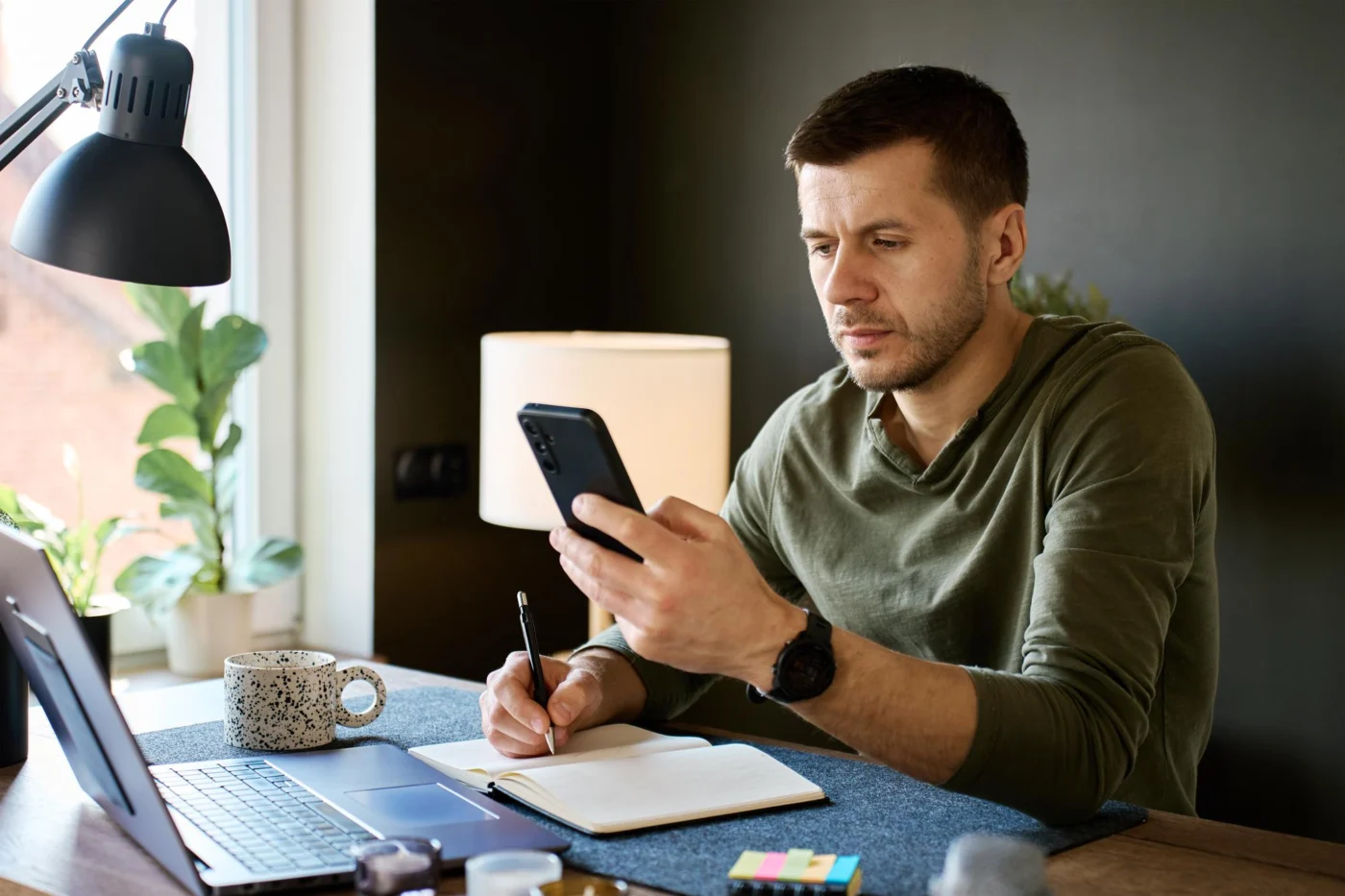 A person using a mobile identity-verification app to confirm their details