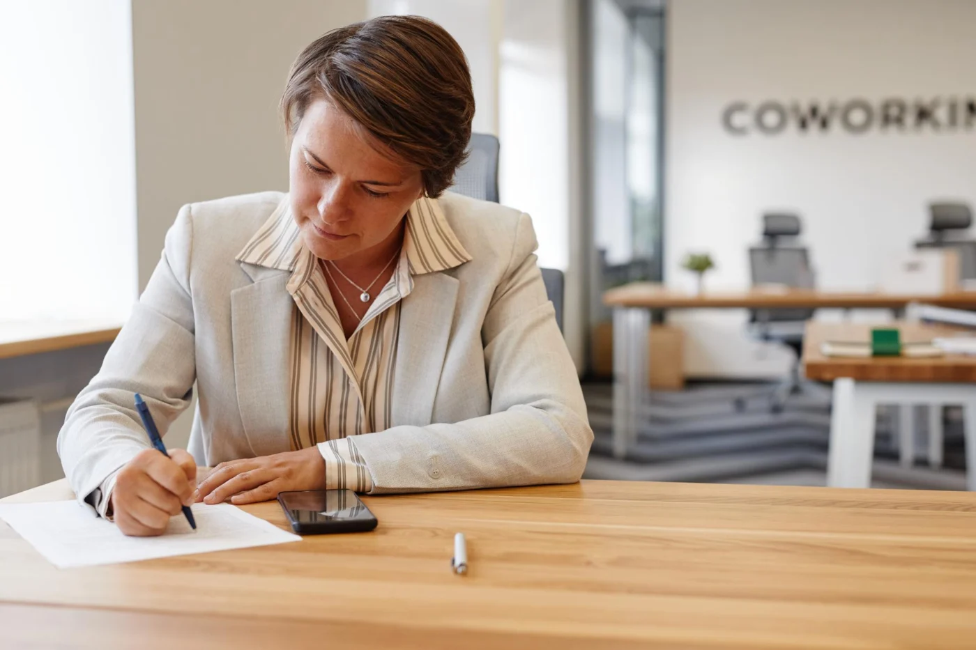 A director reviewing and signing company documents