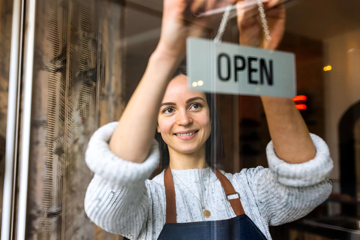 A new business owner opening up their small shop