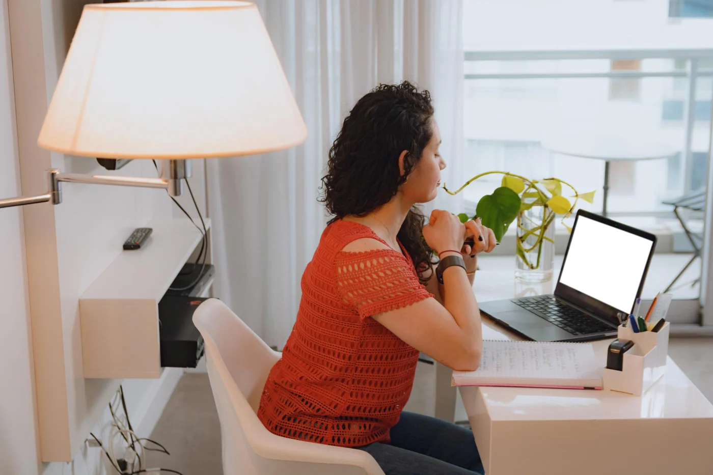 A company director working at a laptop in a home office