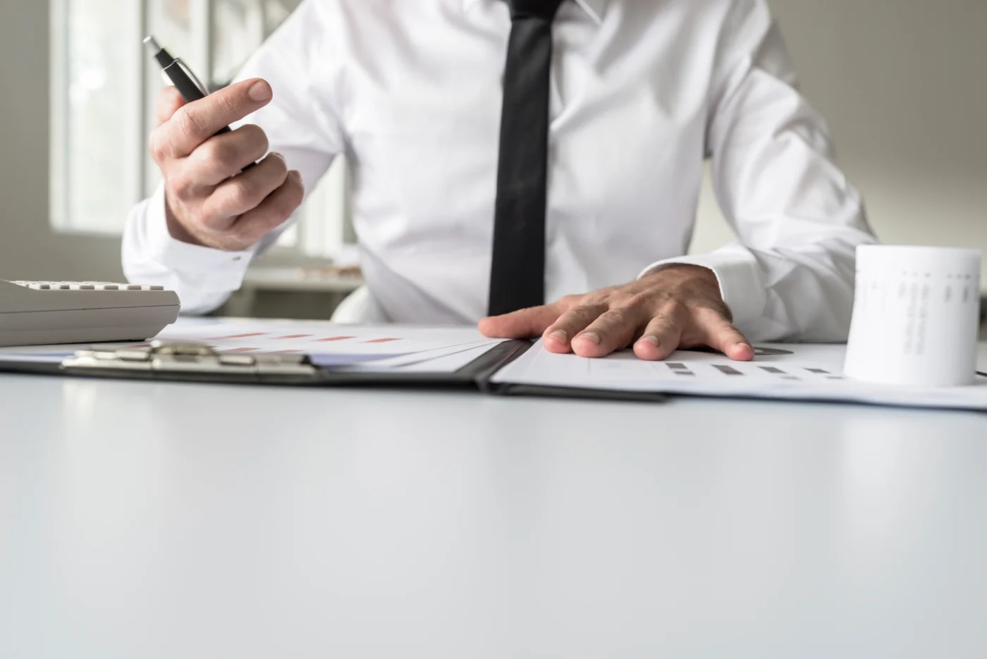 A company director and an adviser reviewing a sale timeline