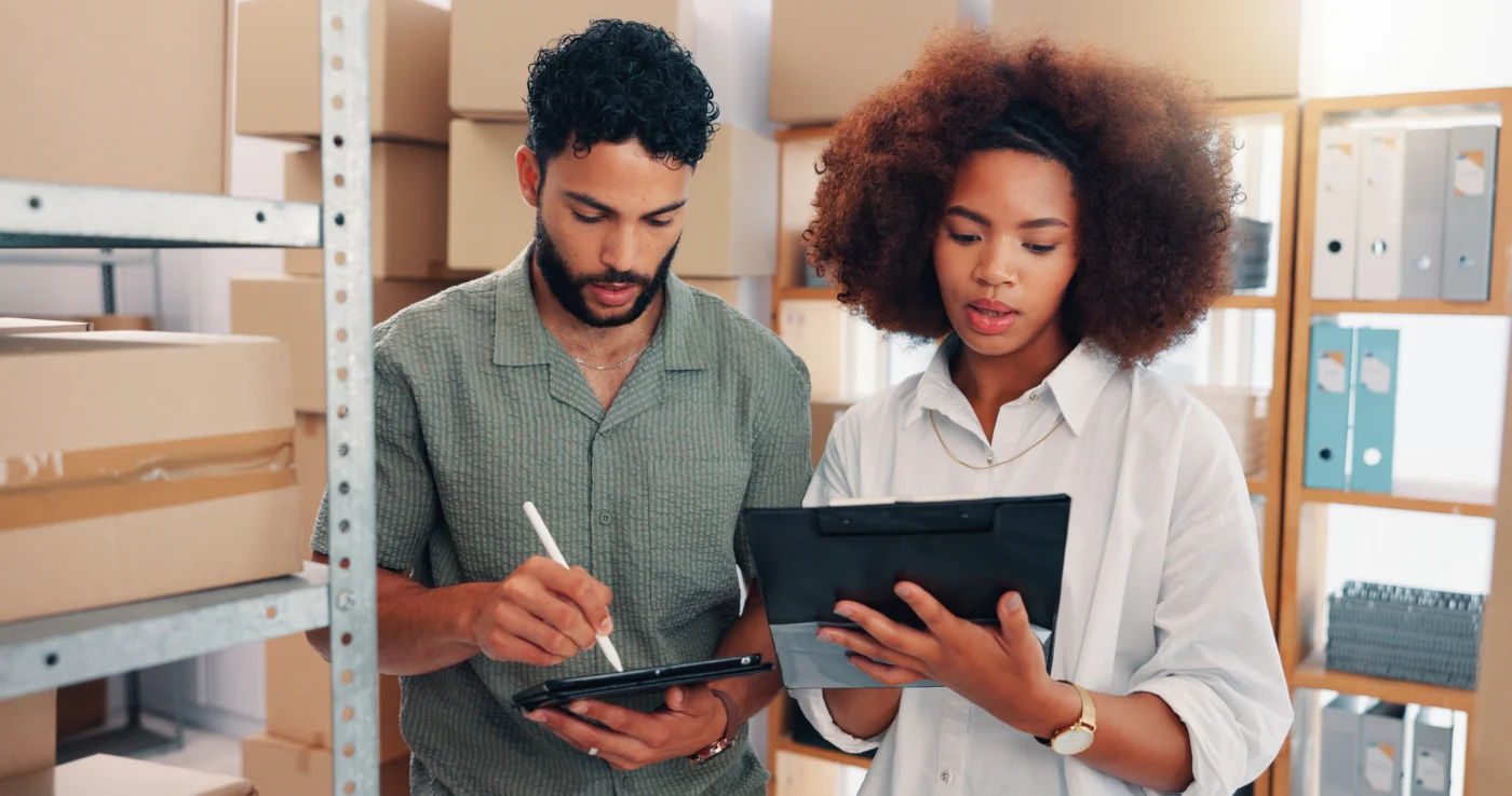 A director checking equipment and stock against a VAT deregistration form