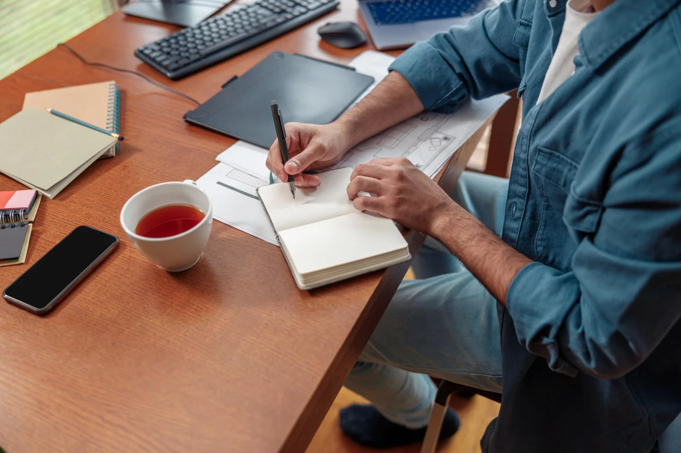 A director reviewing a company name change form at a desk