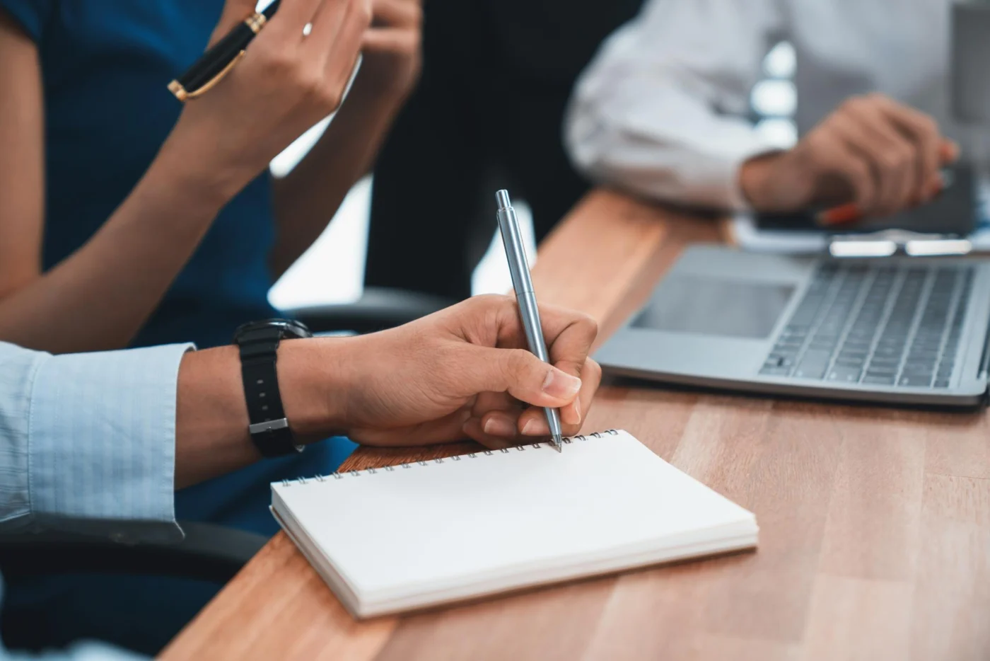 A director reviewing a dividend voucher and company accounts at a desk