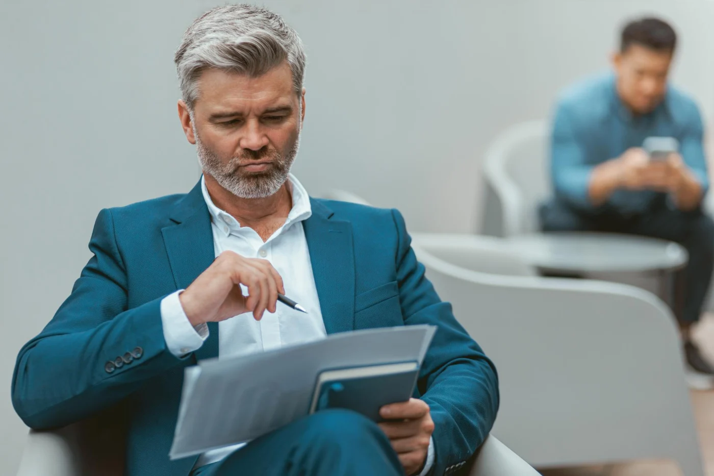 Mature businessman at a desk working through tax documents